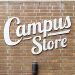 McMaster Campus Store sign on a brick wall.