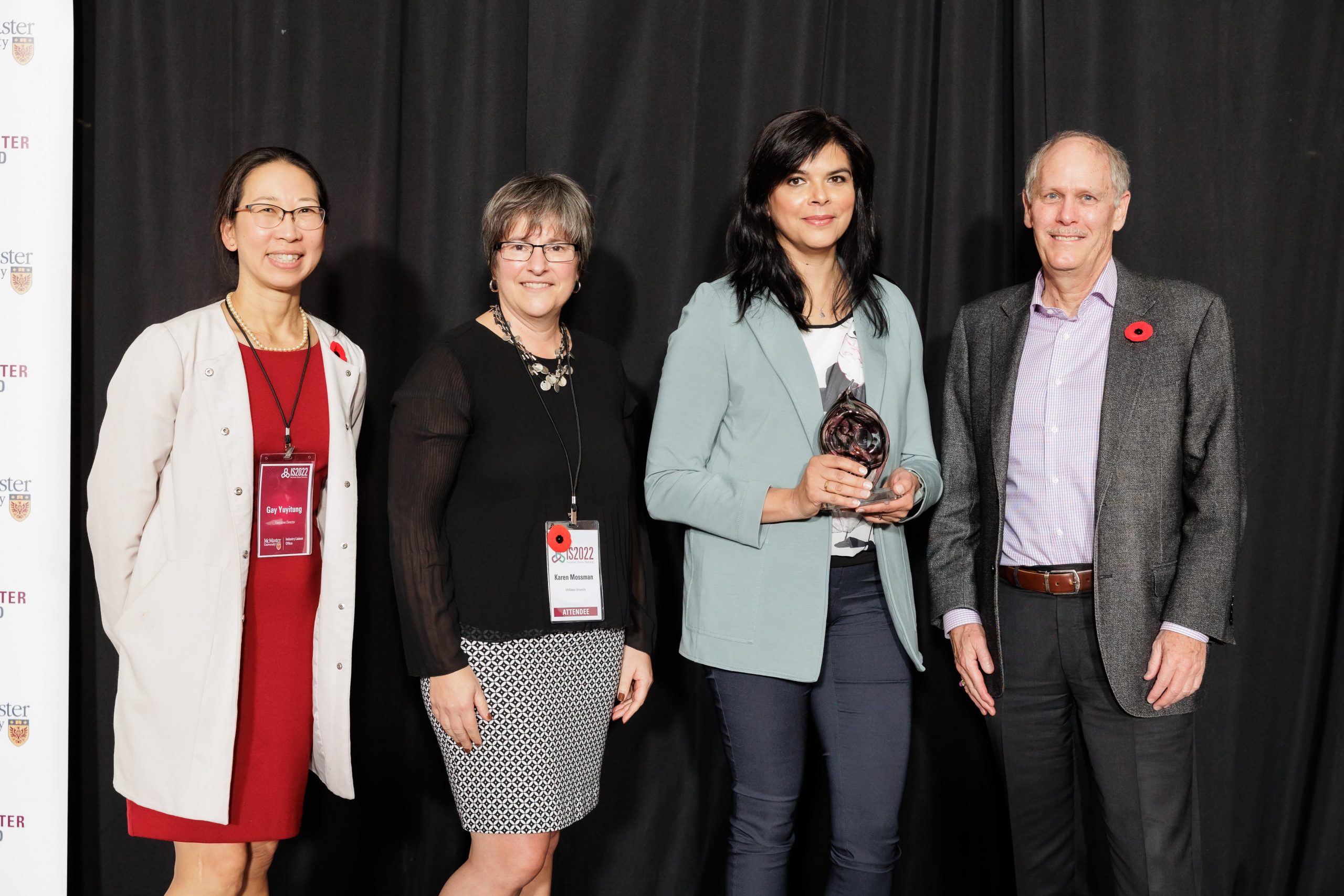 Gina Agarwal is presented the Innovator of the Year award by Gay Yuyitung, executive director of MILO, Karen Mossman, vice-president, research, and David Farrar, president.