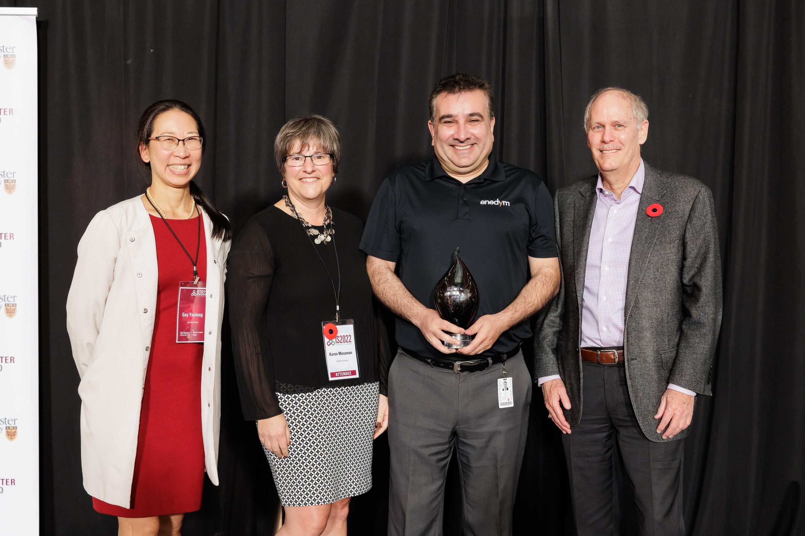 Ali Emadi is presented the Lifetime Innovator award by Gay Yuyitung, executive director of MILO, Karen Mossman, vice-president, research, and David Farrar, president.